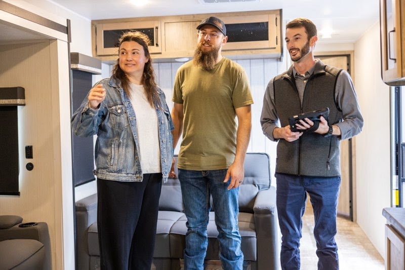 1st Choice Living team walking clients through their temporary RV housing unit